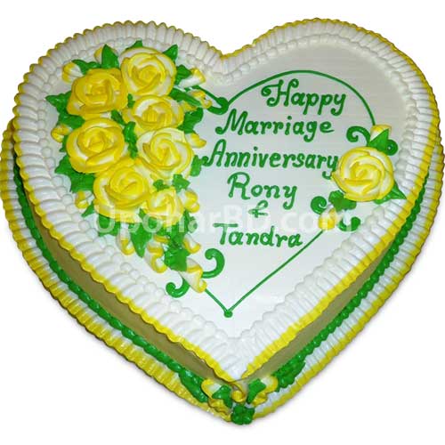 Heart shape cake with green and gold