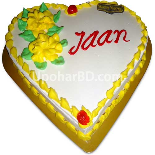 Heart shape cake with large yellow roses