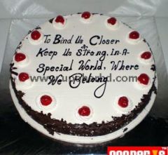 cake with Blackforest flavour and lots of cherry