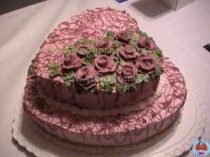 Duel layer heart shape cake with lots of flower