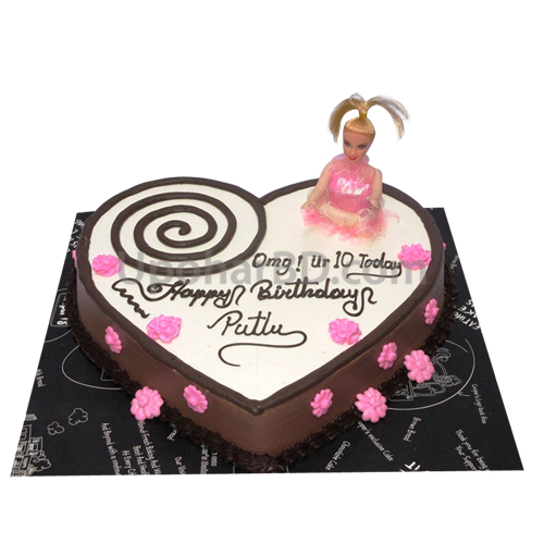 Heart shape birthday cake with doll