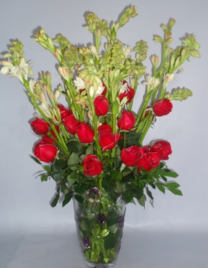 Fresh roses and rajnigandha in a vase