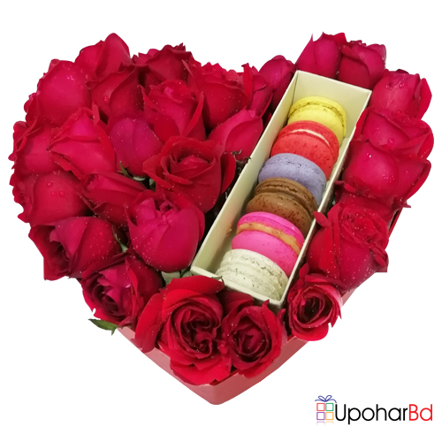 Heart shaped gift box with roses and macaroon