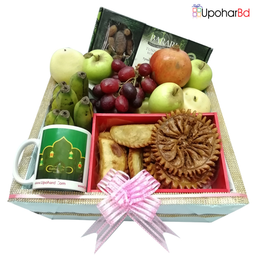 Delicious pithas and fruits gift box