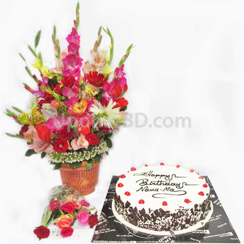 Black forest cake with large flower bouquet