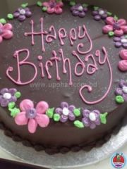 cake with multi-colour flower on chocolate