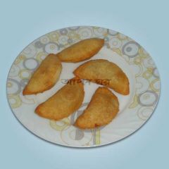 Narikel puli pitha