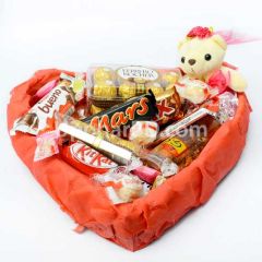 Package of assorted chocolates and teddy